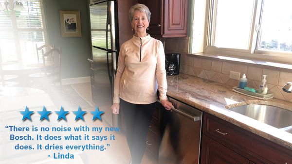 Customer in front of her Bosch dishwasher