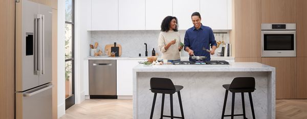 Family cooking in a Bosch kitchen